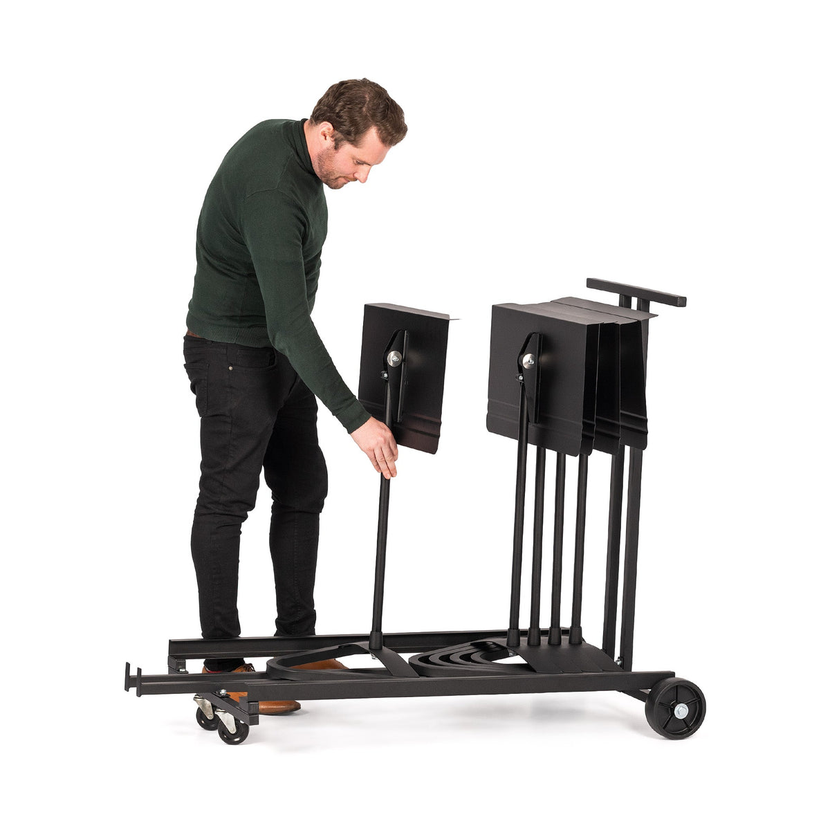 Man placing Harmony stand on MAN1980 harmony stand cart