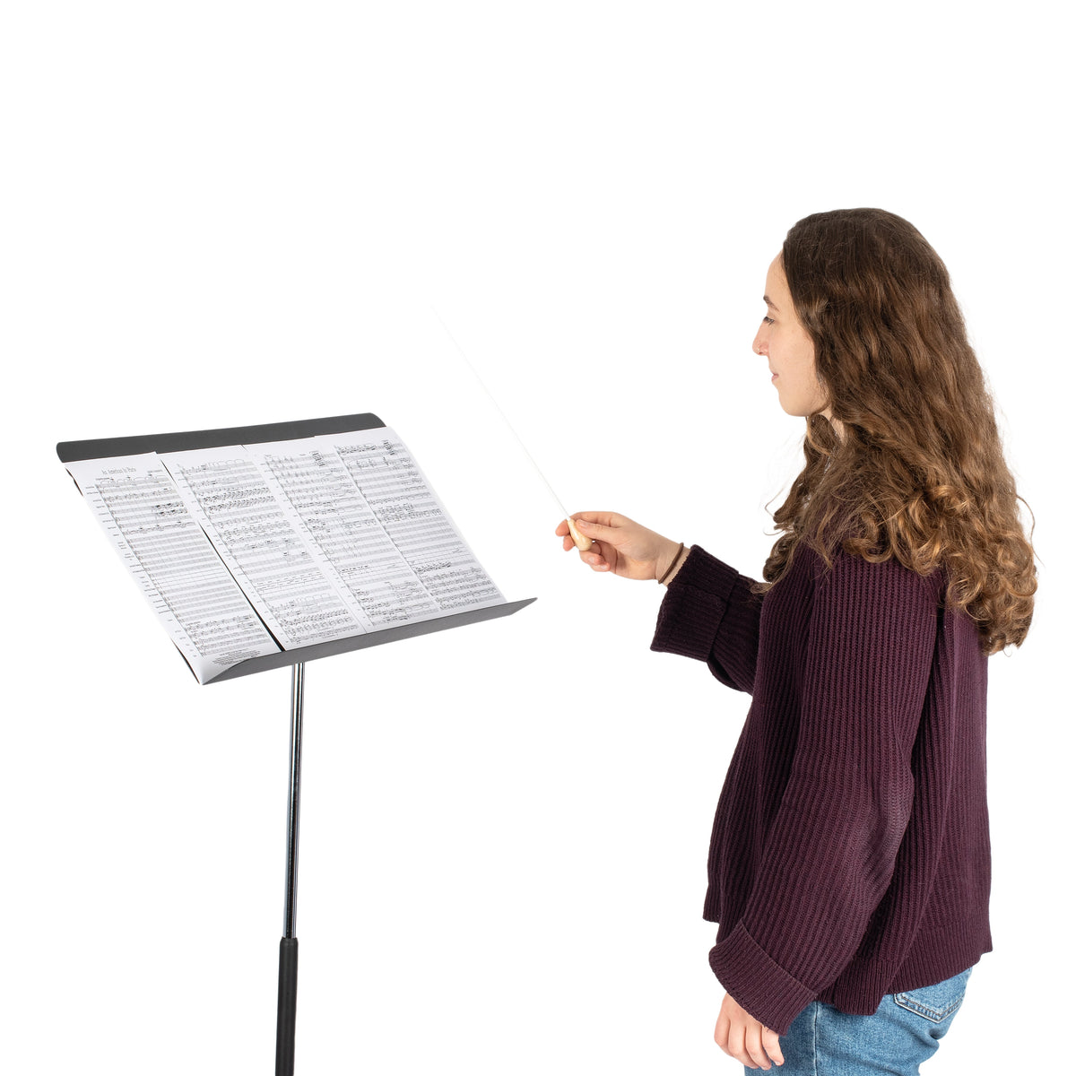 Person conducting in front of the Fourscore music stand with four sheets of music