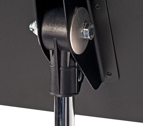 Close up of the back of the desk of a Manhasset music stand showing where the desk joins to the metal shaft